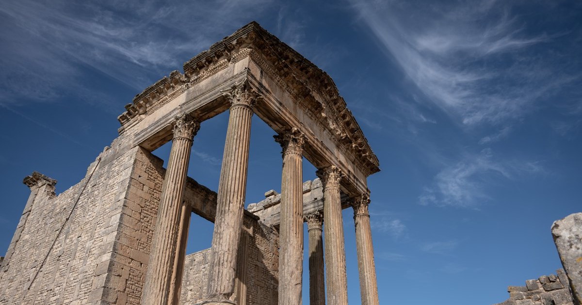 The Capitol at Dougga. The institution outlasts the people who paid to build it.